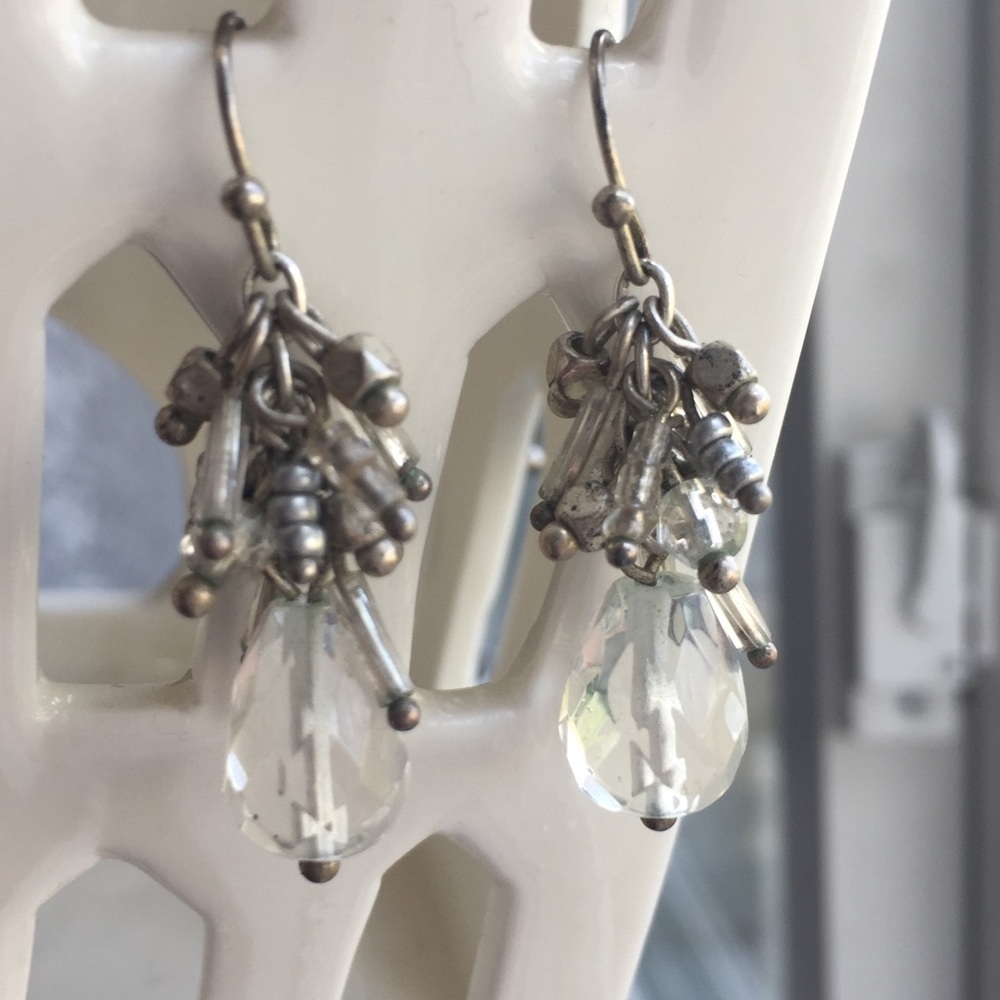 Earrings pre-owned. Clear and silver-colored.